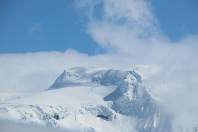 Airplane flight over glacier lagoons and Iceland's highest peak - Hvannadalshnjúkur, Iceland’s highest peak at 2,116 meters