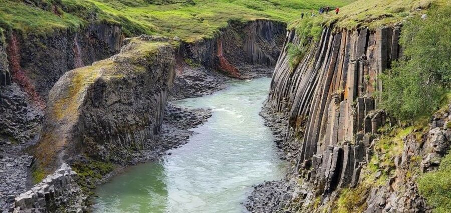 From Reykjavík: 4, 5, 6 or 7-Day Small-Group Ring Road Tour - Day 5: Hraunfossar, horses, and Iceland’s largest lava cave