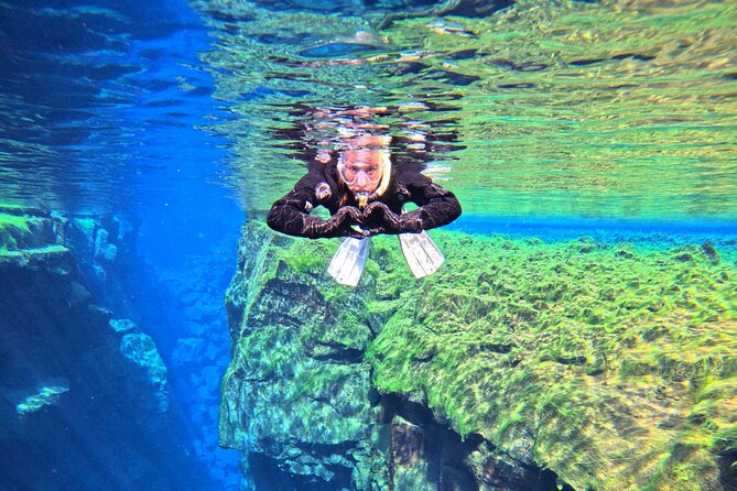 From Reykjavik- Silfra Snorkeling transfer included - Entering the clear water at Silfra