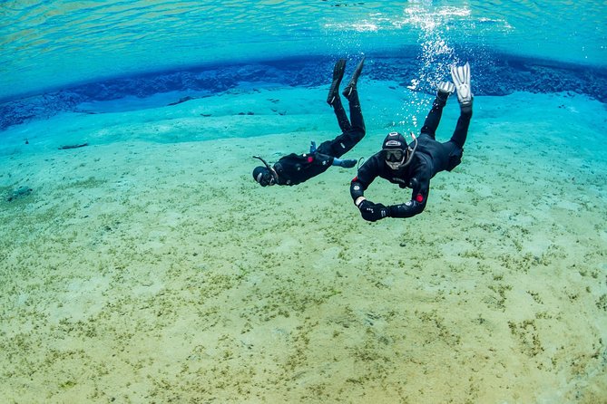 Golden Circle & Silfra Snorkeling Small-Group Supersaver Combo - Getting into the dry suit at Silfra