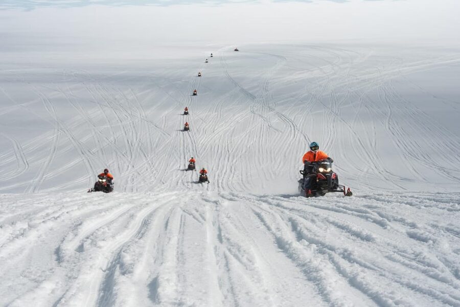 Into the Glacier: Snowmobile + Langjökull Ice Tunnel Combo - Clothing, licenses, and the shared snowmobile setup