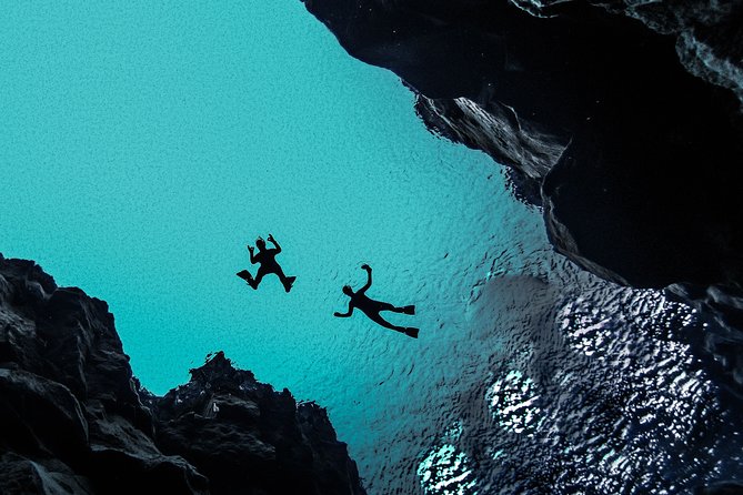 Silfra Drysuit Snorkeling Tour with Free Photos - From Reykjavik - Walking out, warming up, and collecting your photos