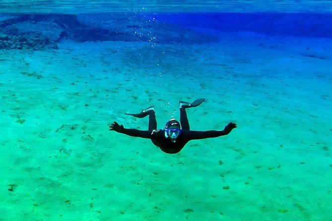 Silfra Wetsuit Snorkeling Tour with Underwater Photos - From Reykjavik - Wetsuit or drysuit?