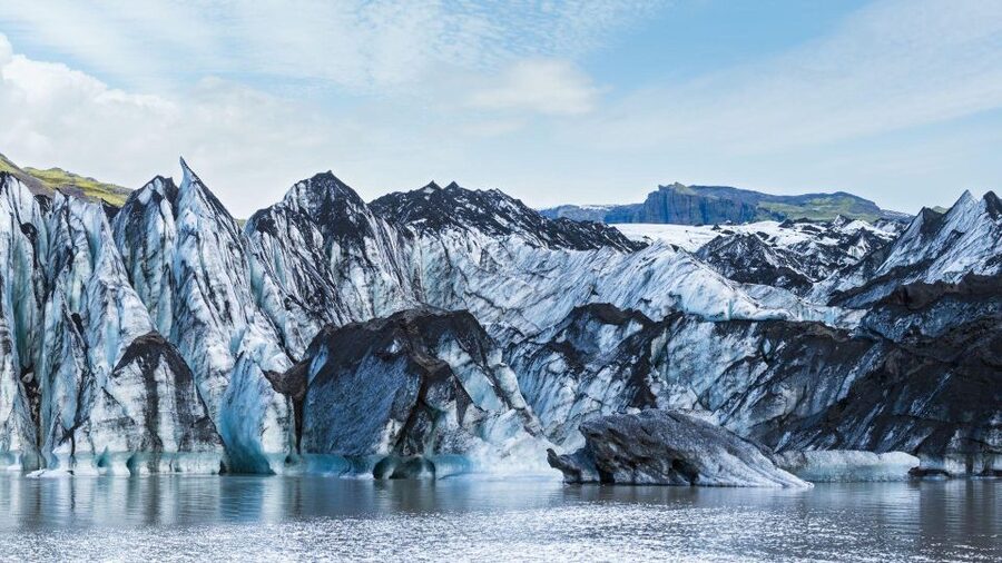 South Coast of Iceland. Black beach, glaсier, waterfalls... - Dyrhóley: volcanic rock above the Atlantic
