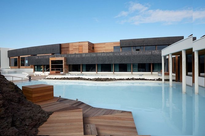 Unique bathing in an Icelandic hot springs at the Blue Lagoon - The Blue Lagoon setting: warm water, cold air, black rock